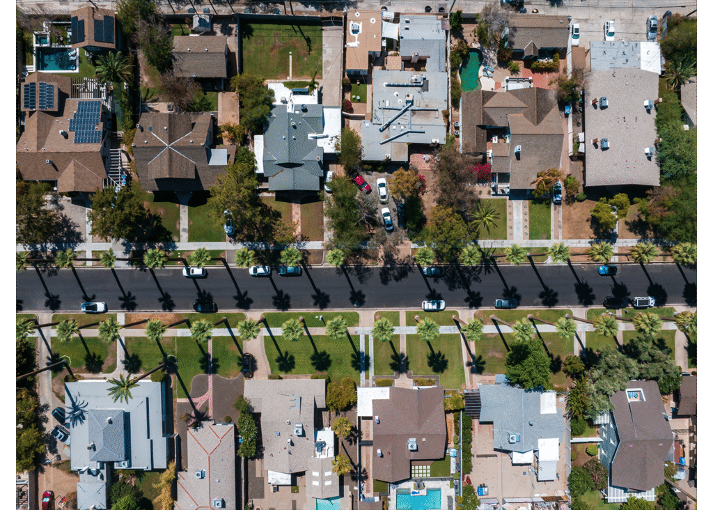 Aerial view of a residential neighborhood in Dothan, Alabama, showcasing tree-lined streets, single-family homes, and well-maintained yards.