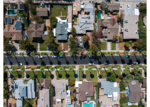 Aerial view of a residential neighborhood in Dothan, Alabama, showcasing tree-lined streets, single-family homes, and well-maintained yards.